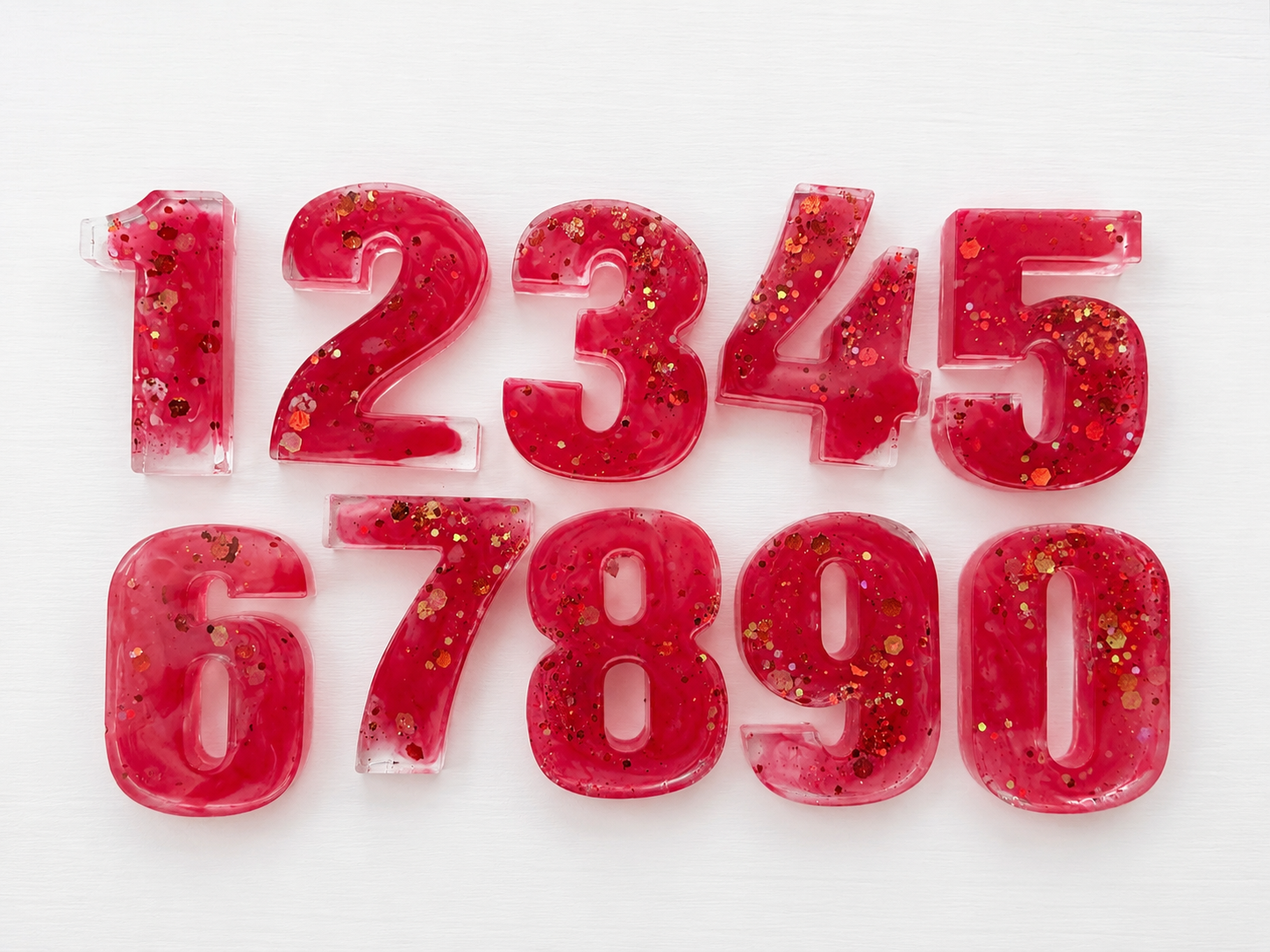Set of pink glitter resin numbers zero through nine
