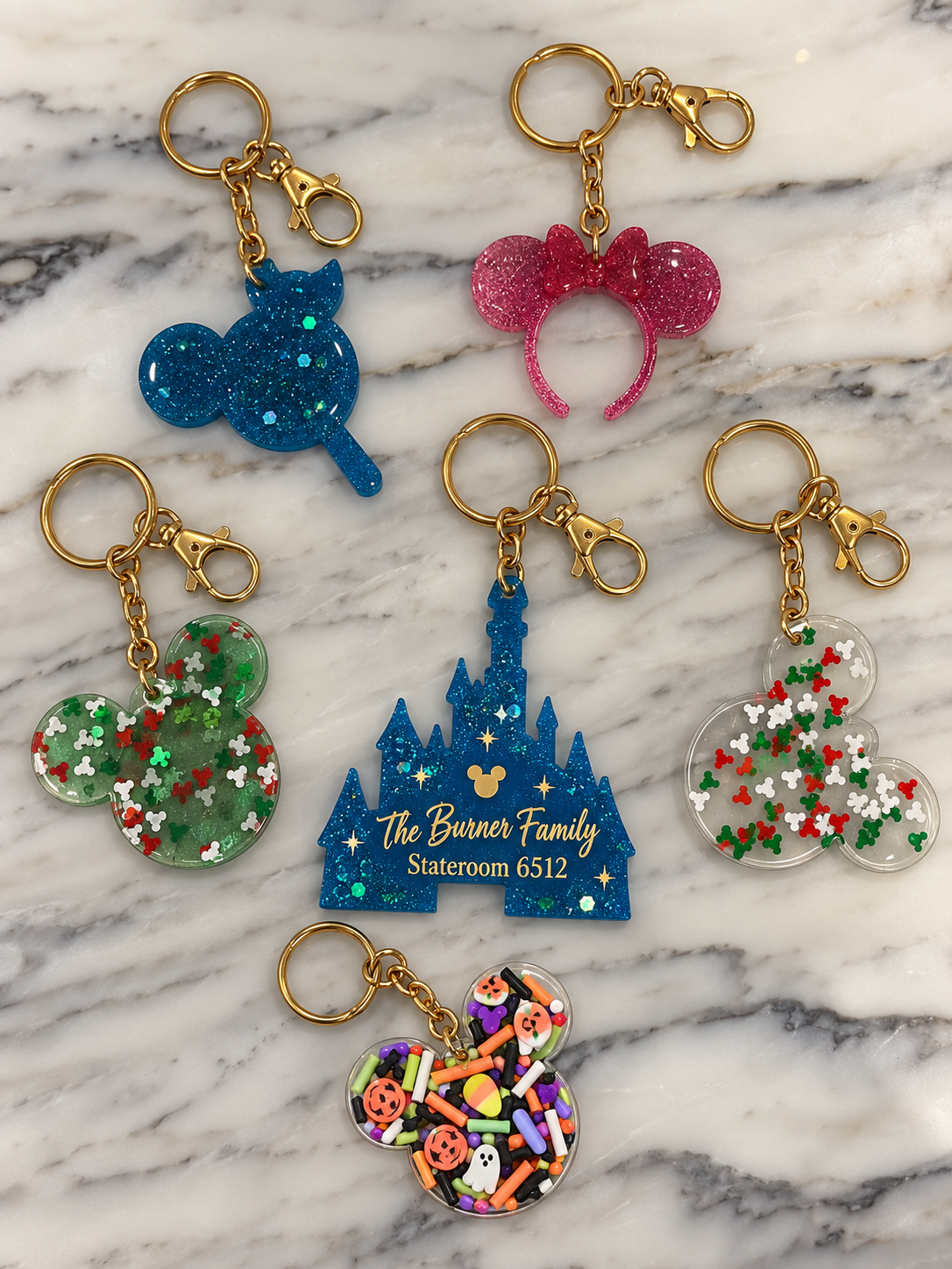 Collection of personalized resin keychains in various shapes and colors